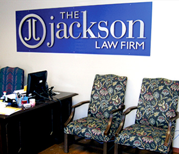 The Jackson Law Firm Logo on the Wall